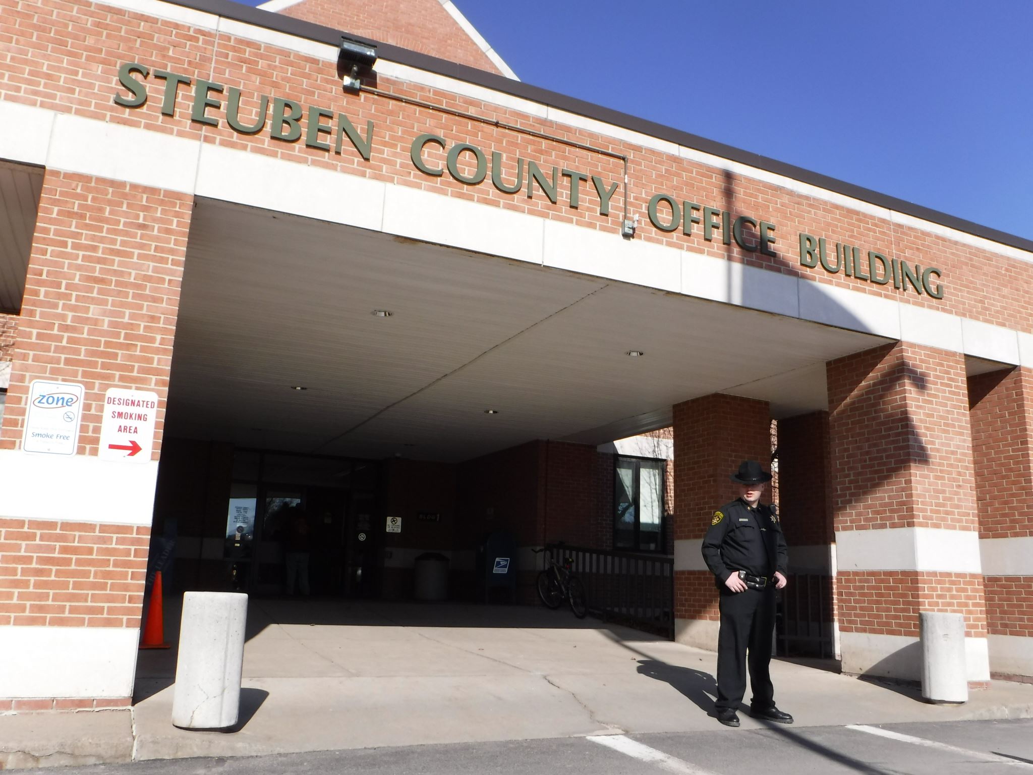 Deputy Warriner Standing infront of Steuben County Office Building